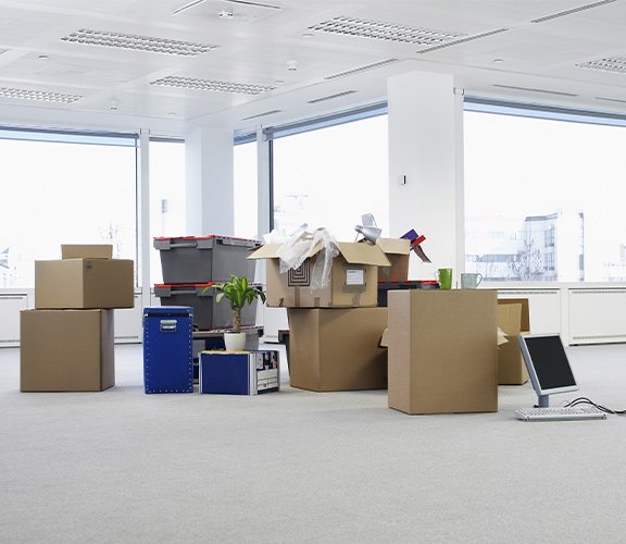 Commercial relocation scene with furniture and equipment packed